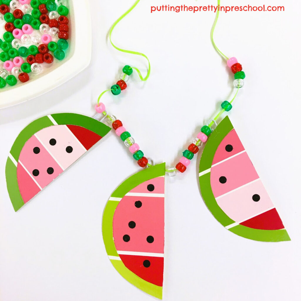How to make a beaded necklace with paint chip watermelon slices and green, red, pink, and clear pony beads.