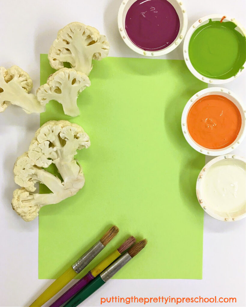An invitation to make vegetable prints with cauliflower florets and orange, purple, green, and cream tempera paints.
