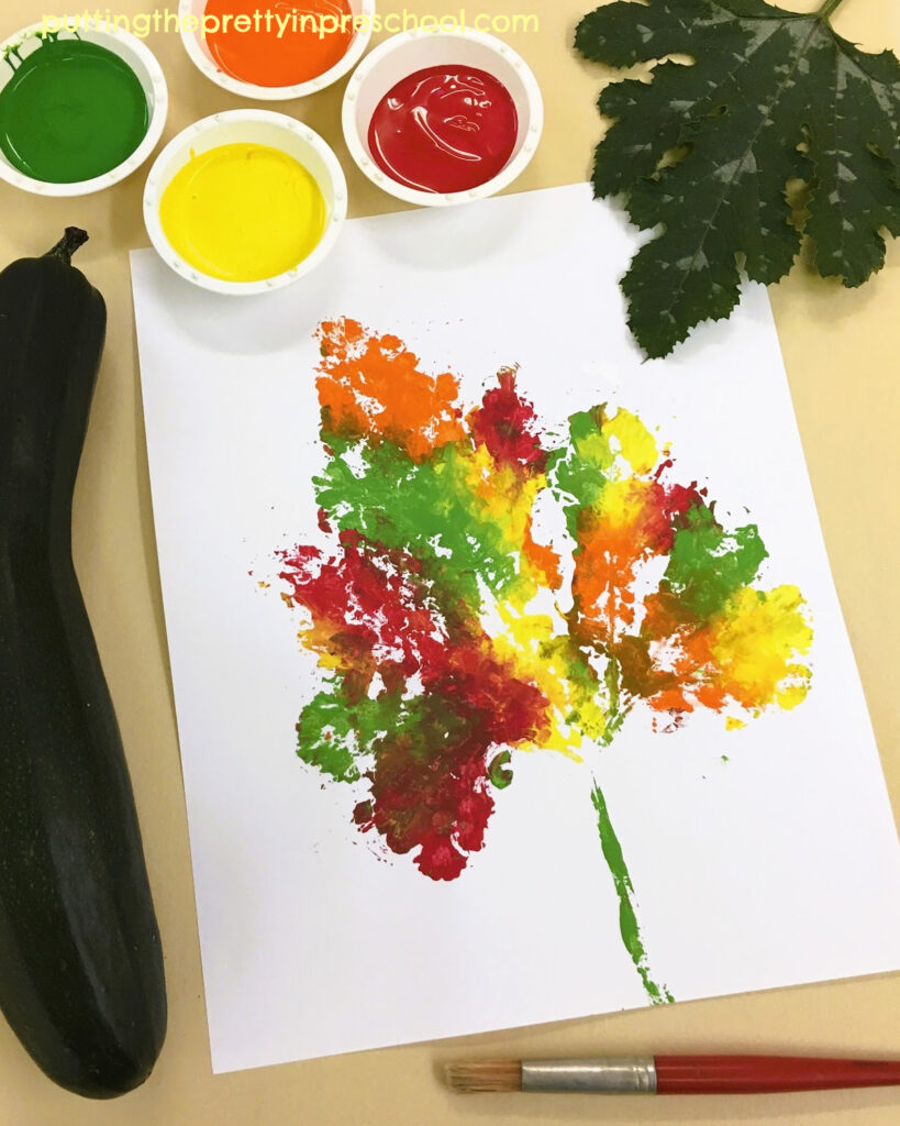 How to make a leaf print in fall colors with a large zucchini leaf and tempera paint. An all-ages art activity everyone will enjoy.