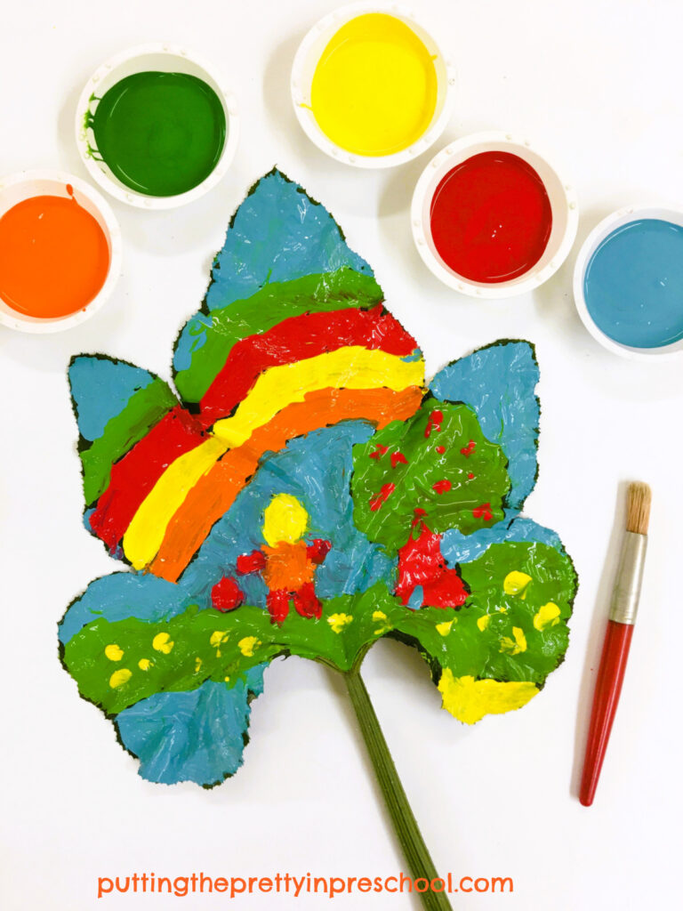 Paint a large pumpkin leaf canvas with fall-colored tempera paints for a beautiful transient art project.