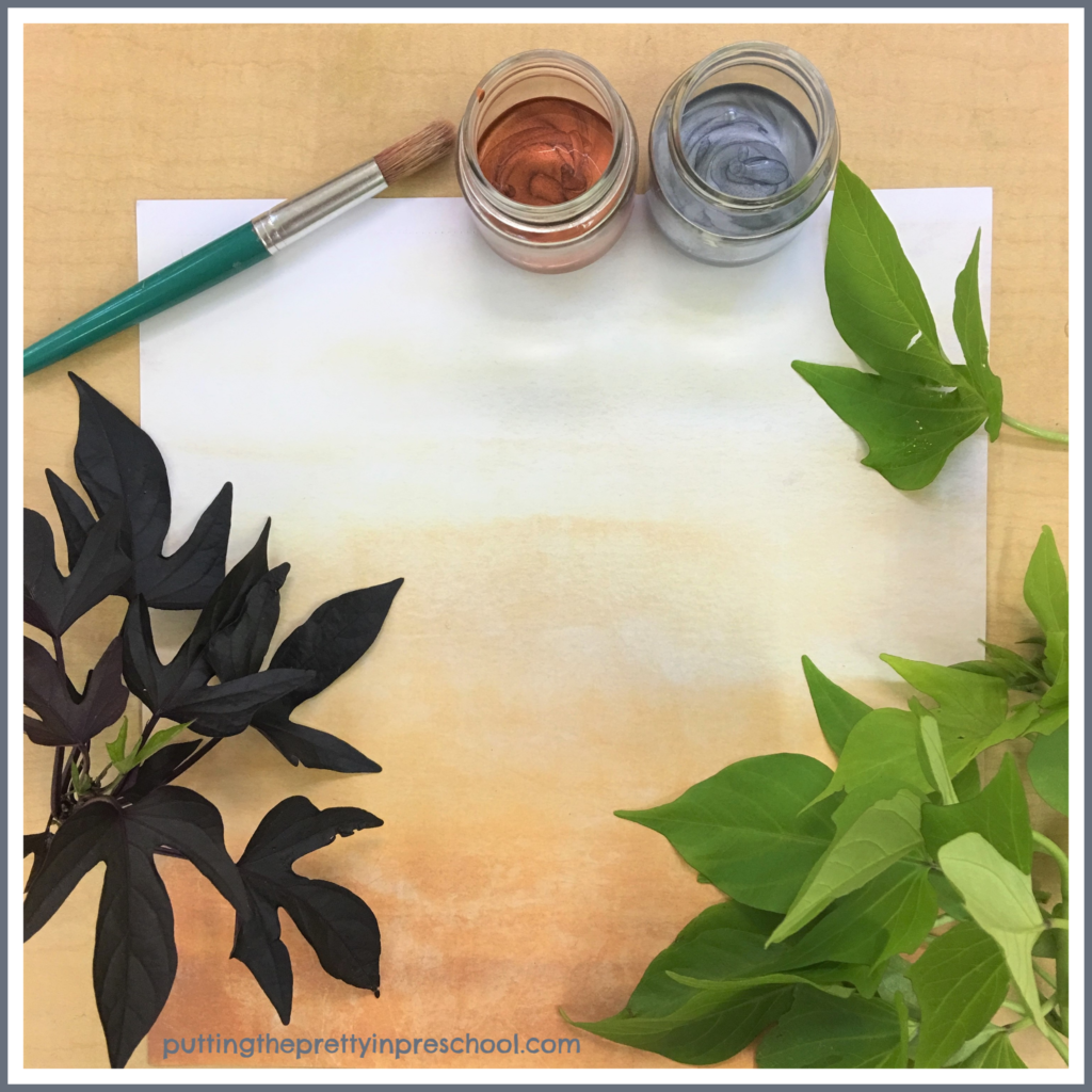 An invitation to make leaf prints shaped like dinosaur footprints with silver and bronze paints and sweet potato vine leaves.