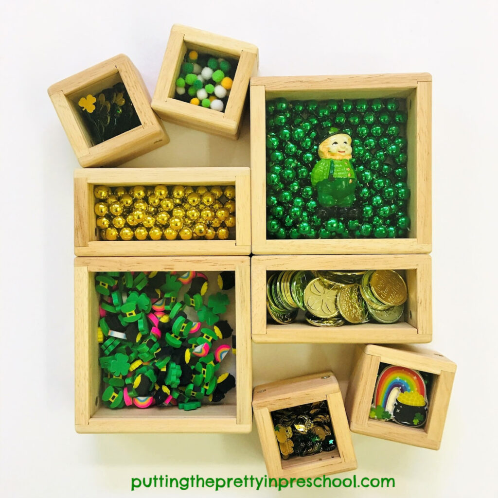St. Patrick's Day treasure blocks featuring a leprechaun and shamrock themed craft supplies and coins.