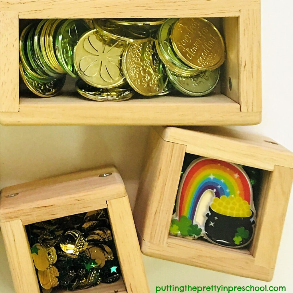St. Patrick's Day treasure blocks featuring rainbow stickers, coins and pot of gold confetti.