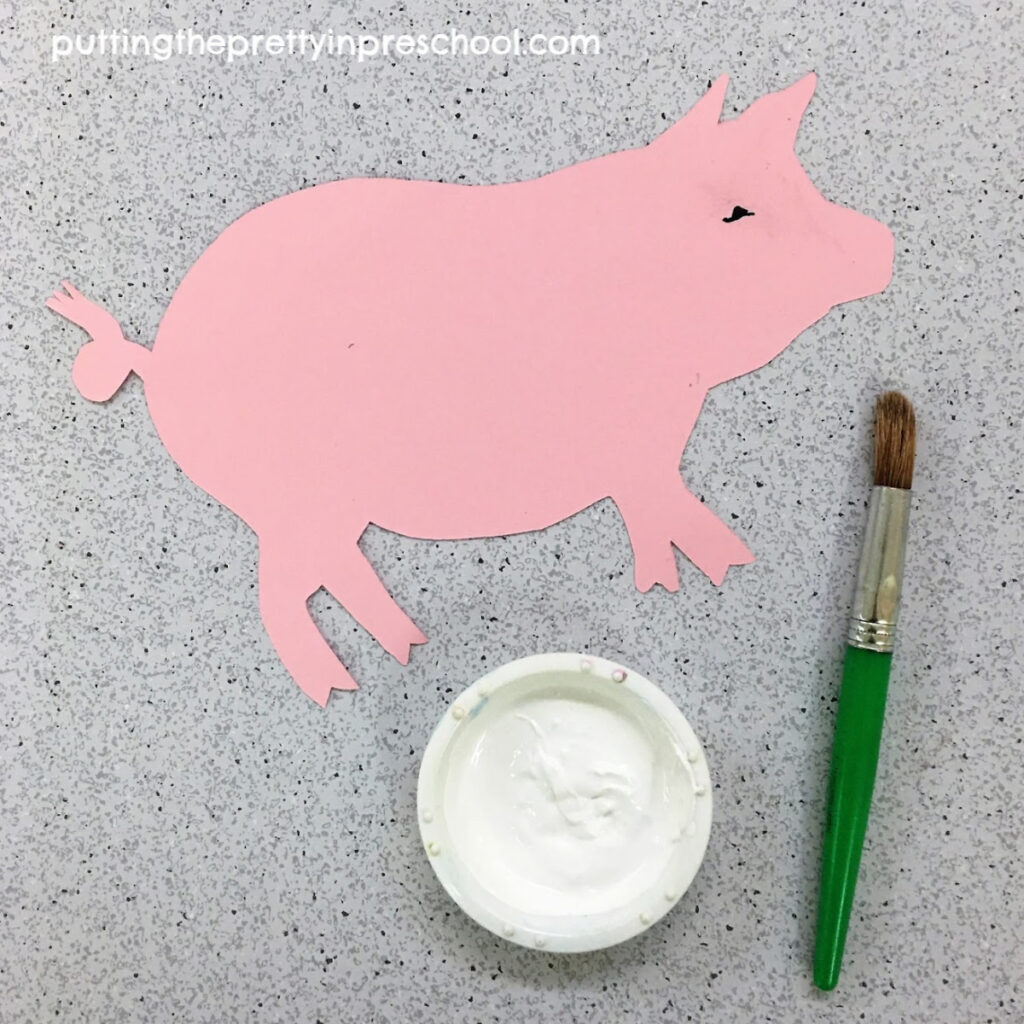 Paint the pig white. An art activity inspired by the storybook "Charlotte's Web."