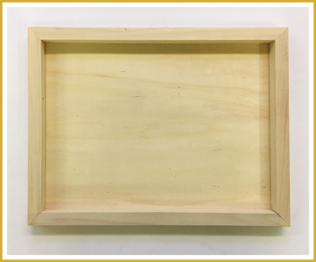 A wooden canvas paint board to be used as a shadow box.