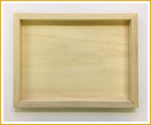 A wooden canvas paint board to be used as a shadow box.