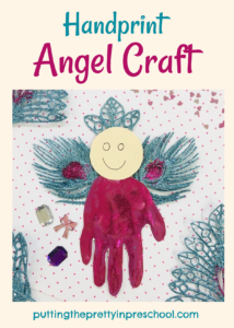 Handprint angel craft in magenta and turquoise colors.