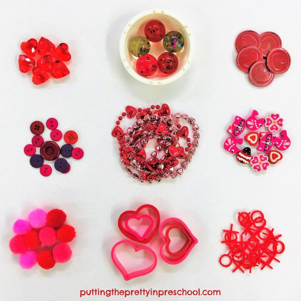 Loose parts to add to Valentine's Day containers to make shaker and drum musical instruments.