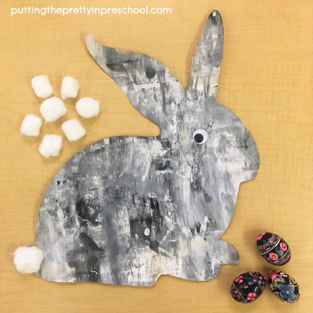 Striking black and white painted bunny using a rolling pin painting technique.