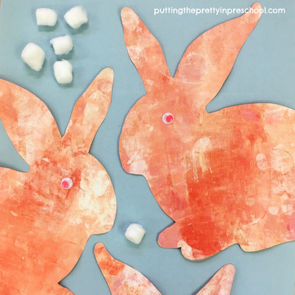 Sweet coral painted bunnies using a rolling pin painting technique.