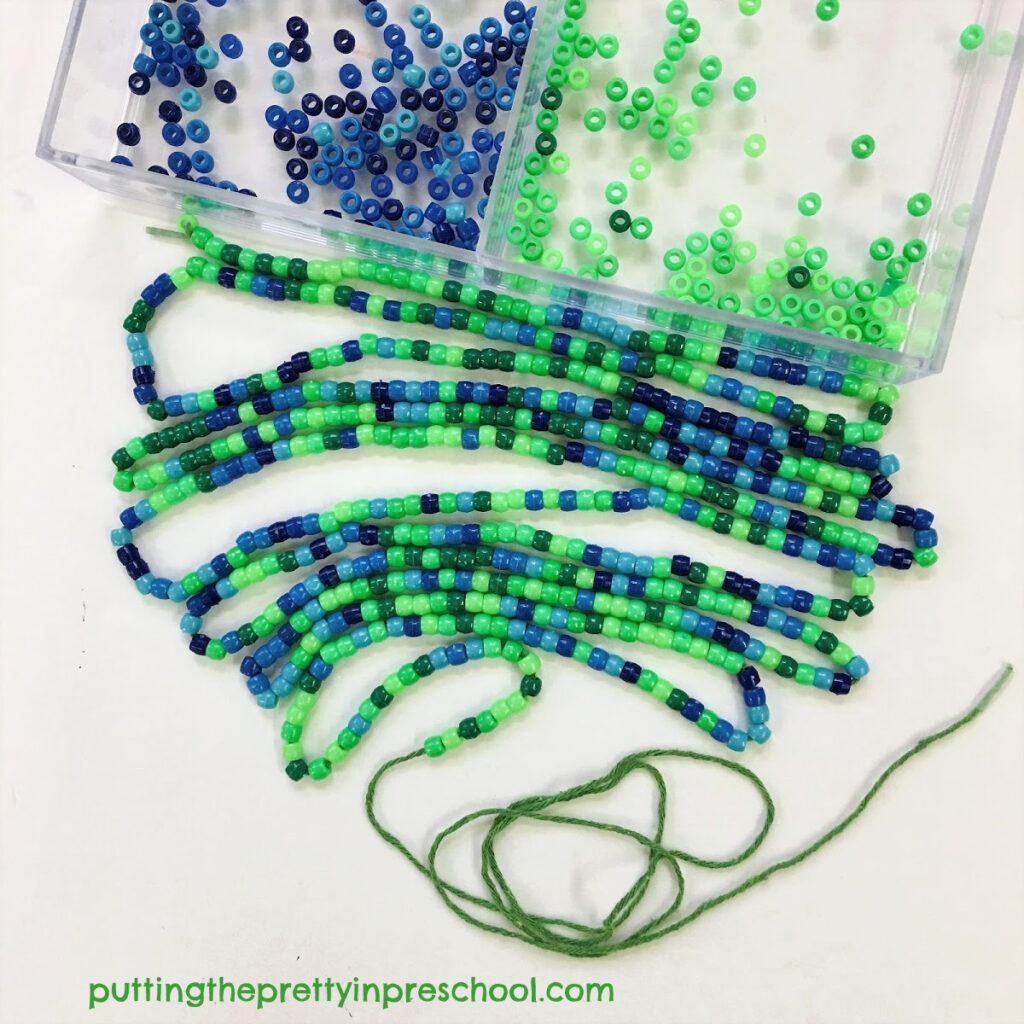 Invitation to string blue and green pony beads for an earth day craft.