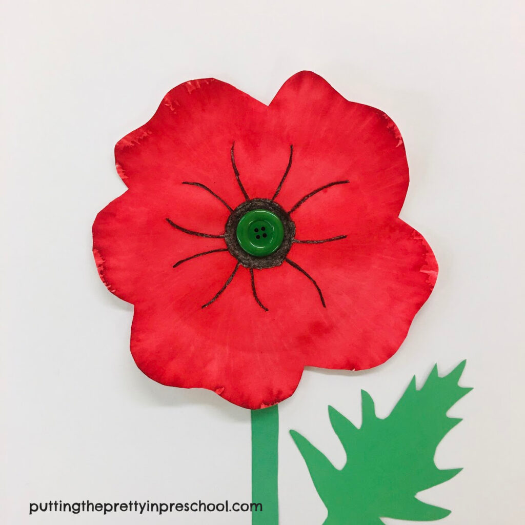 A paint-over-felt pen technique adds a watercolor effect to this paper plate poppy.