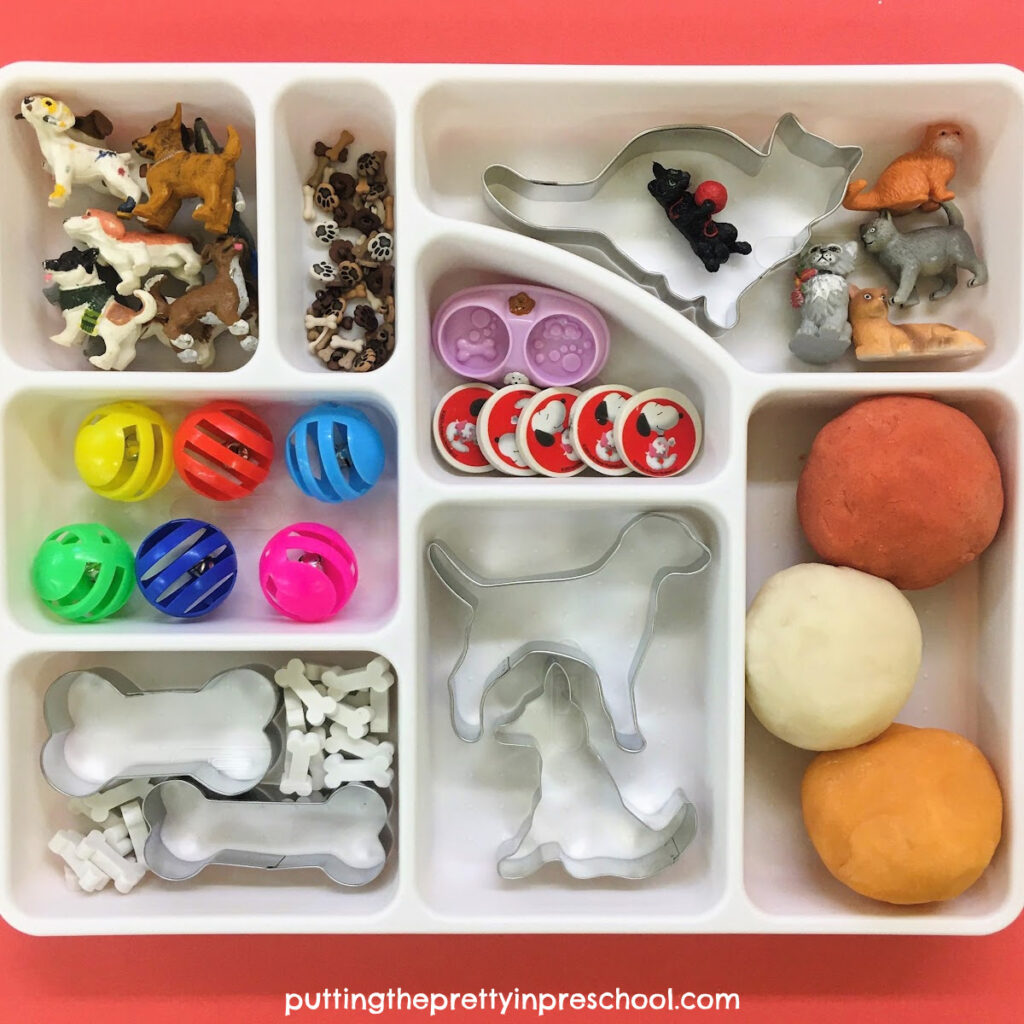 An inviting supply of cat and dog-themed playdough accessories. Links to three easy-to-make playdough recipes are included.