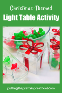 Invitation to scoop and sort Christmas-themed reusable ice cubes in this magical light exploration play activity for little learners.