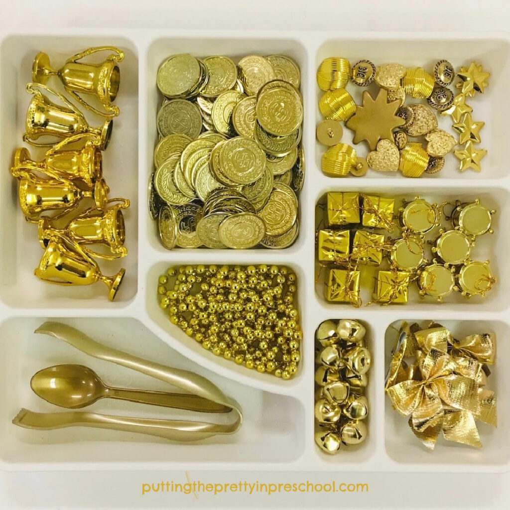 New Year's all gold sensory bin loose parts tray for little learners to explore.