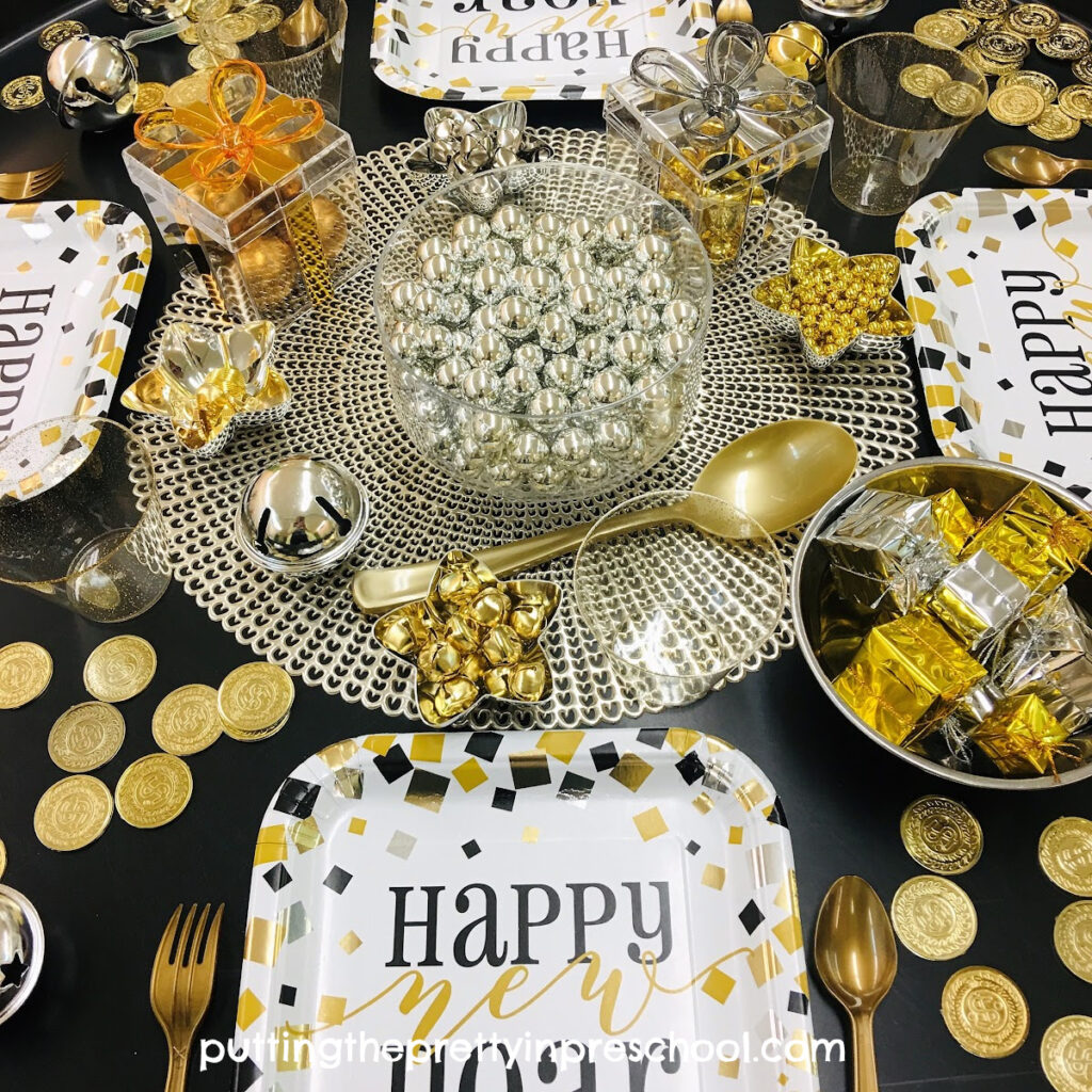 New Year's Eve sensory play tray with a party theme.