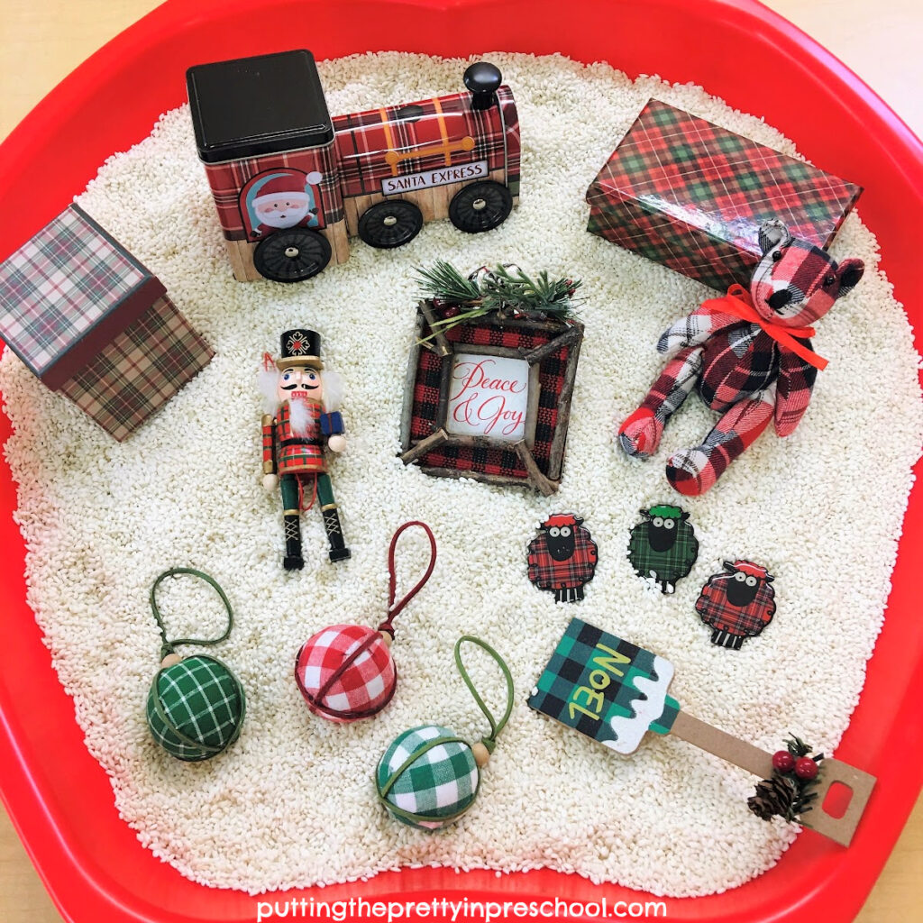 A delightful plaid-themed holiday rice bin filled with cozy items for little learners to explore year after year.
