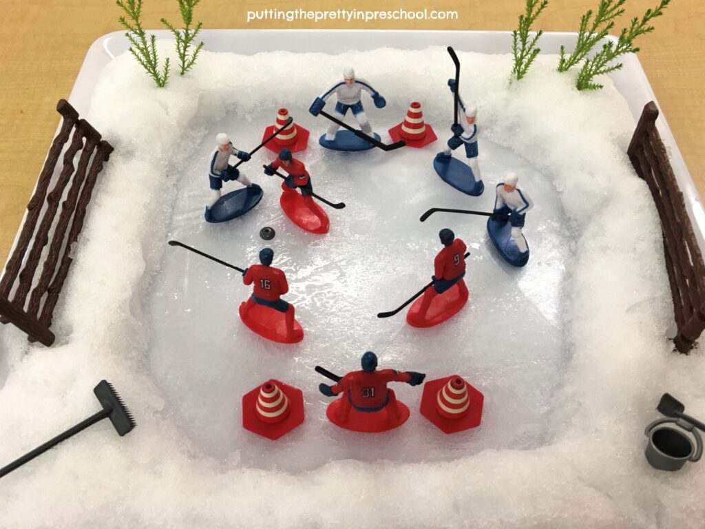 A sensory opportunity-filled hockey game small world with real ice and snow.