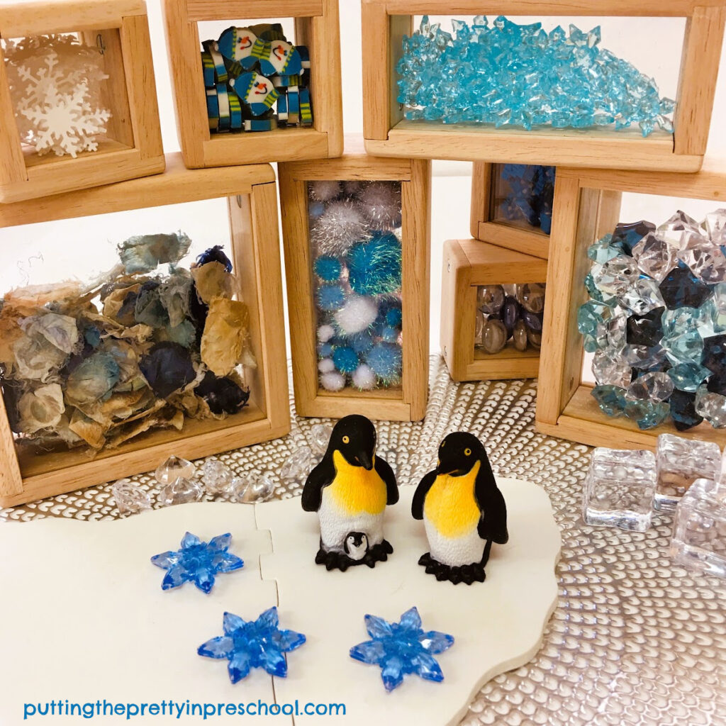 These winter-themed treasure blocks make the perfect backdrop for a pair of penguins.