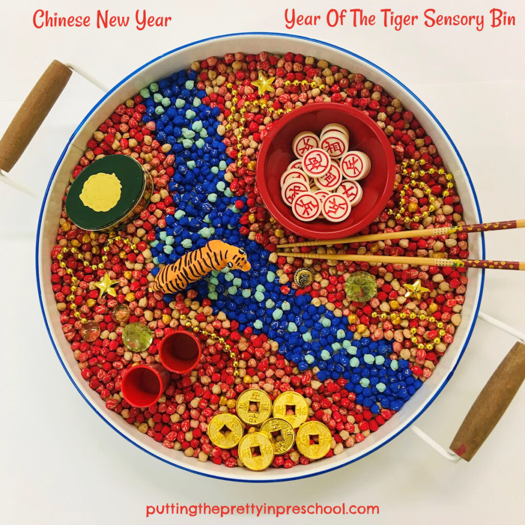 This Chinese New Year chickpea-based sensory bin represents the year of the tiger.