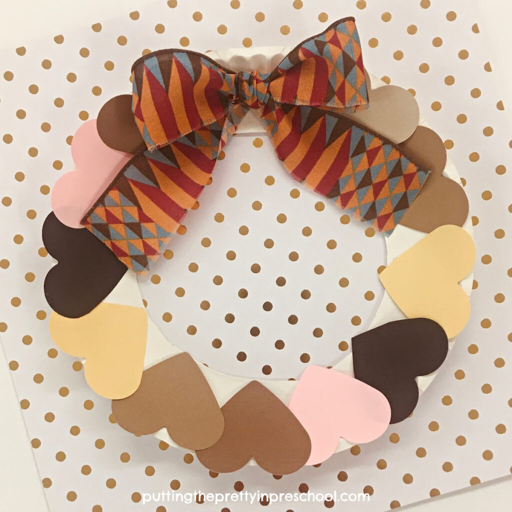 Black History Month ribbon and skin-toned hearts are the highlights of this easy-to-make "kindness" wreath craft.