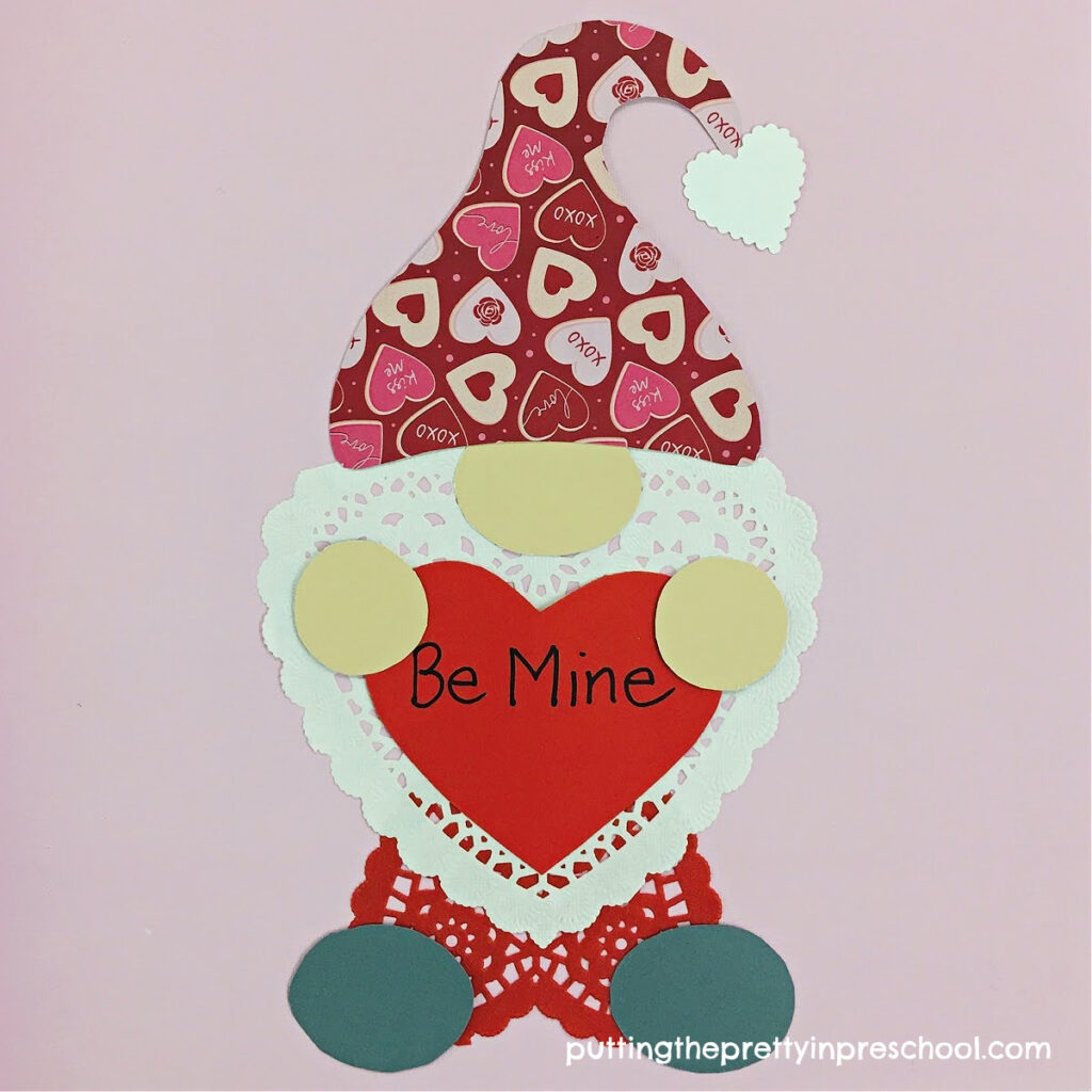 Sweet multicultural gnome valentine with exquisite heart doilies taking center stage.