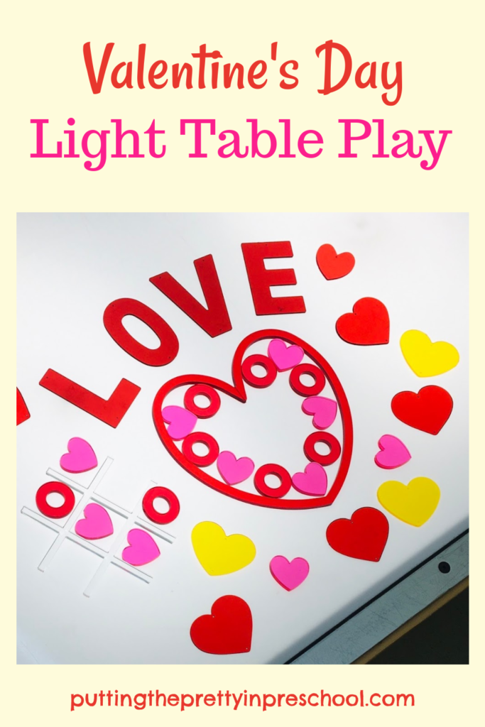 A Valentine's Day light table activity with transparent loose parts to use for math, games, and transient art.