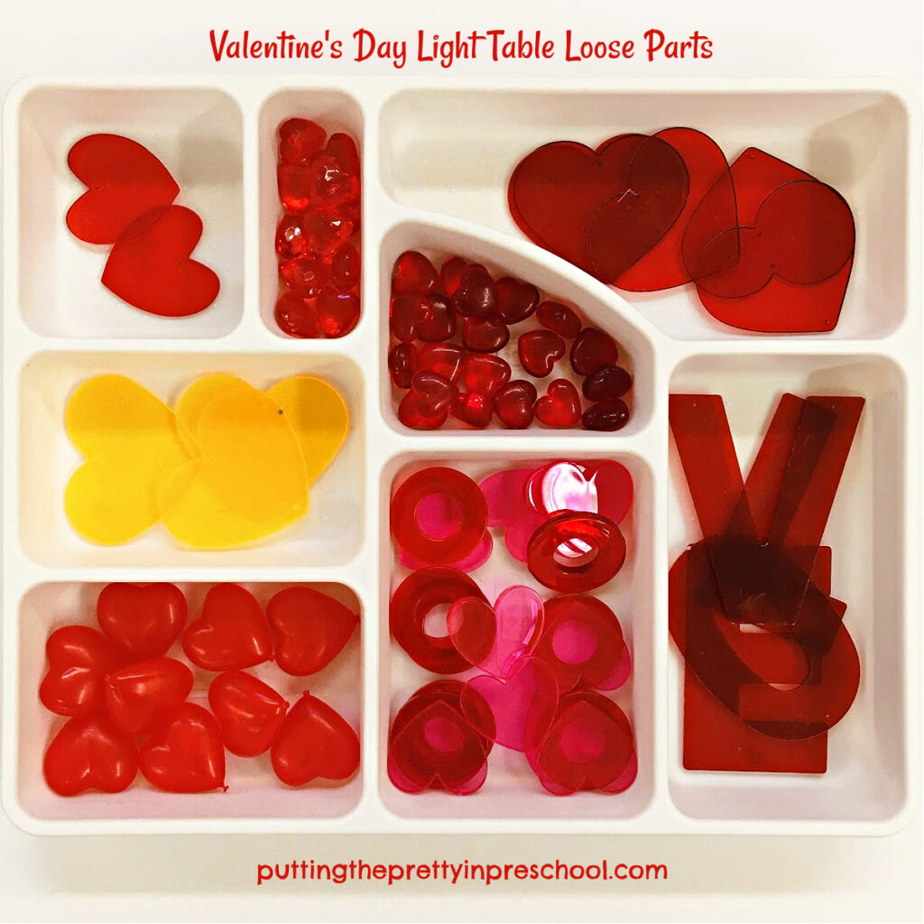 Set this Valentine's Day loose parts tray on the light table to inspire creative play.