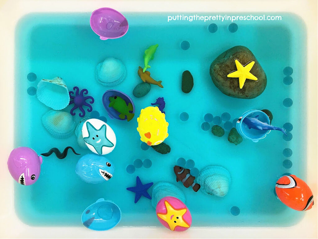 Set up this easy and fun water-based ocean sensory tub. Aquatic Easter eggs are the highlight of the play invitation.