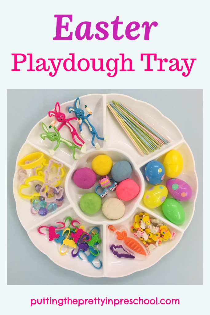 A colorful Easter playdough tray filled with spring-themed loose parts your little learners will love to explore.