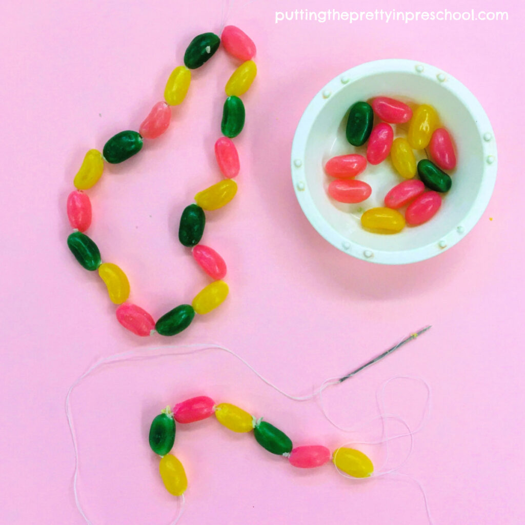 String a jelly bean necklace to wear or use in a craft. A super fun activity with pattern-making possibilities.