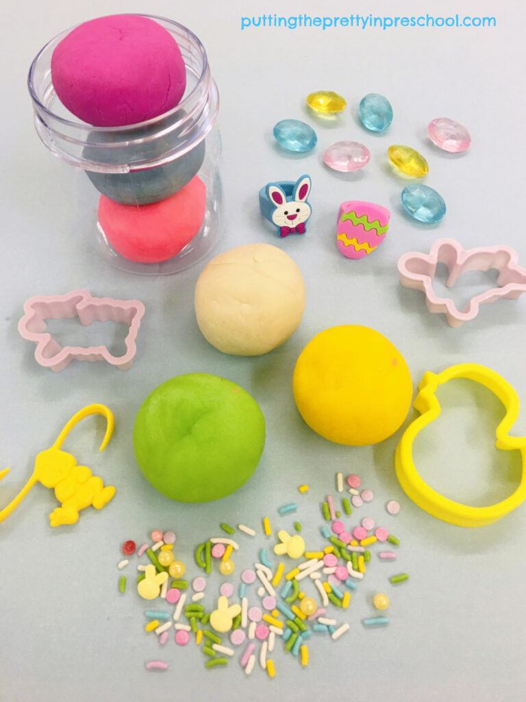 Spring-themed candy sprinkles add the perfect finishing touch to this cheery playdough invitation.