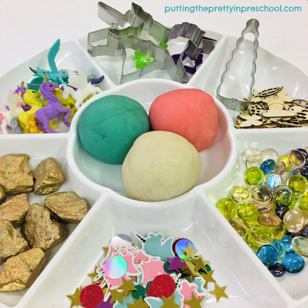 Set up this unicorn theme playdough tray in minutes. The best playdough recipes are featured.