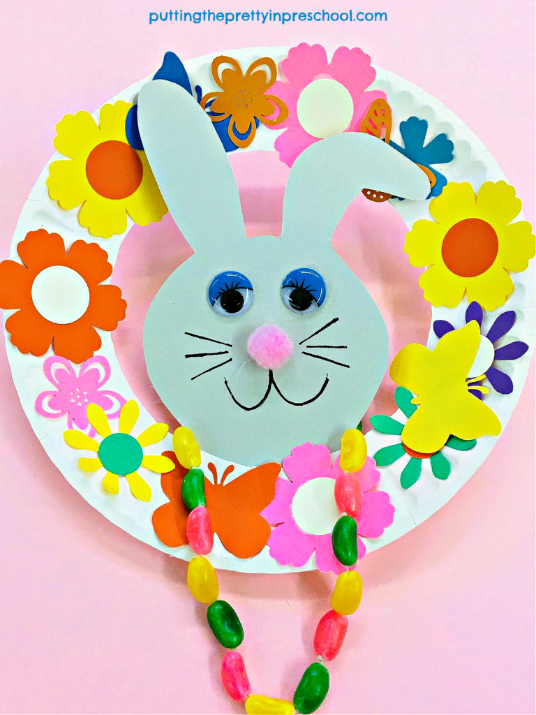 This paper plate bunny wreath will brighten up any space, The jelly bean necklace is the highlight of the craft.