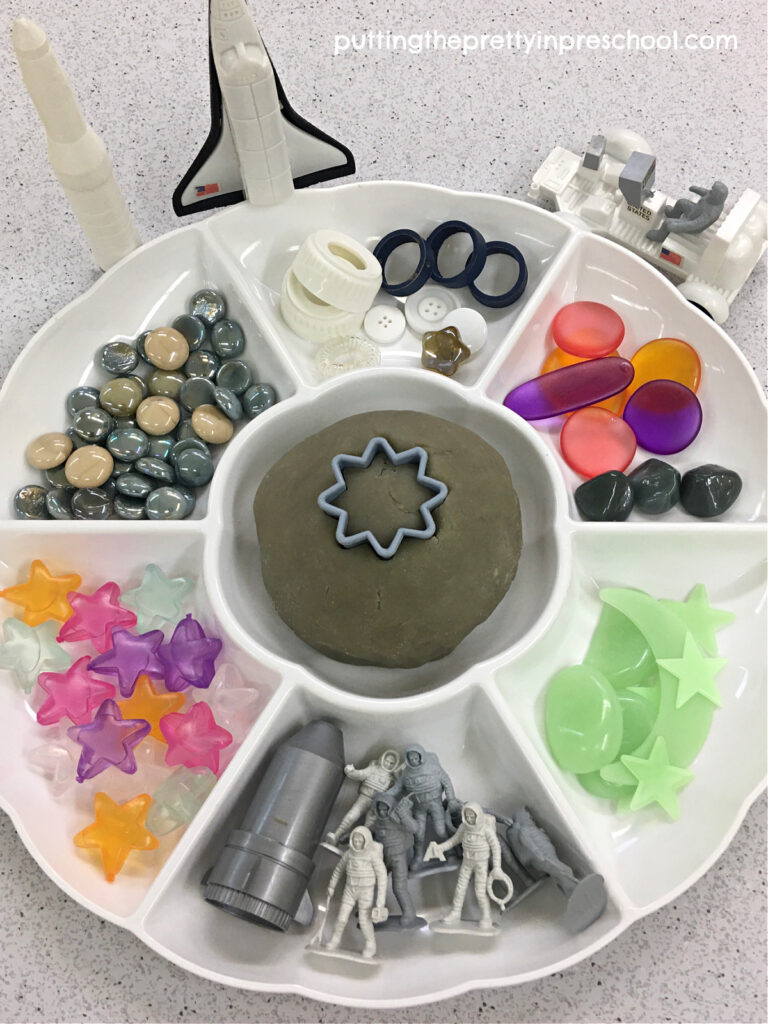 Your child will love to explore space with this moon playdough tray. The homemade playdough is amazing!