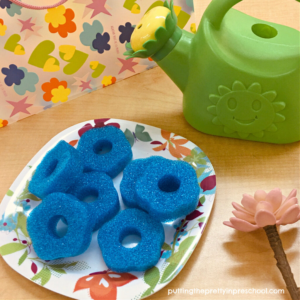Sliced flower-themed pool noodles make great "cookies" for a flower stand dramatic play center.