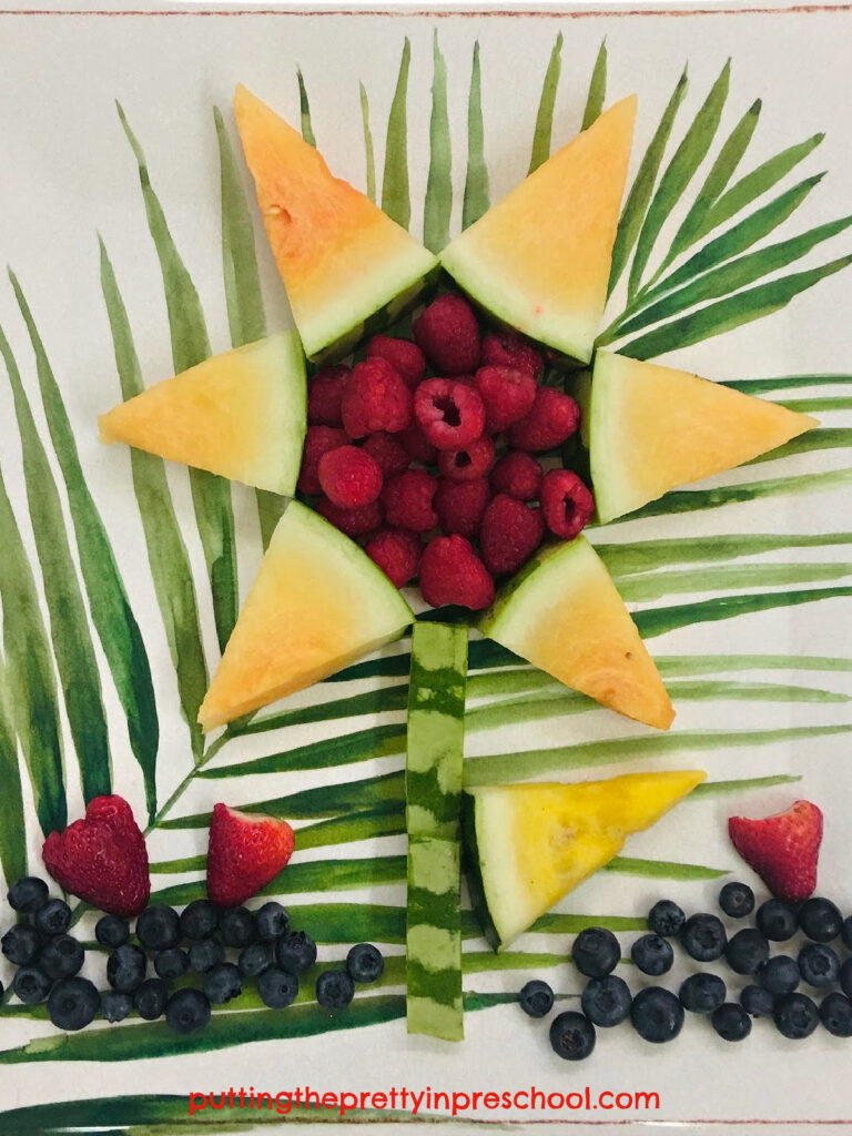 Make this sunflower-shaped snack with orange and yellow watermelon and raspberries. Add strawberries and blueberries for garnish.